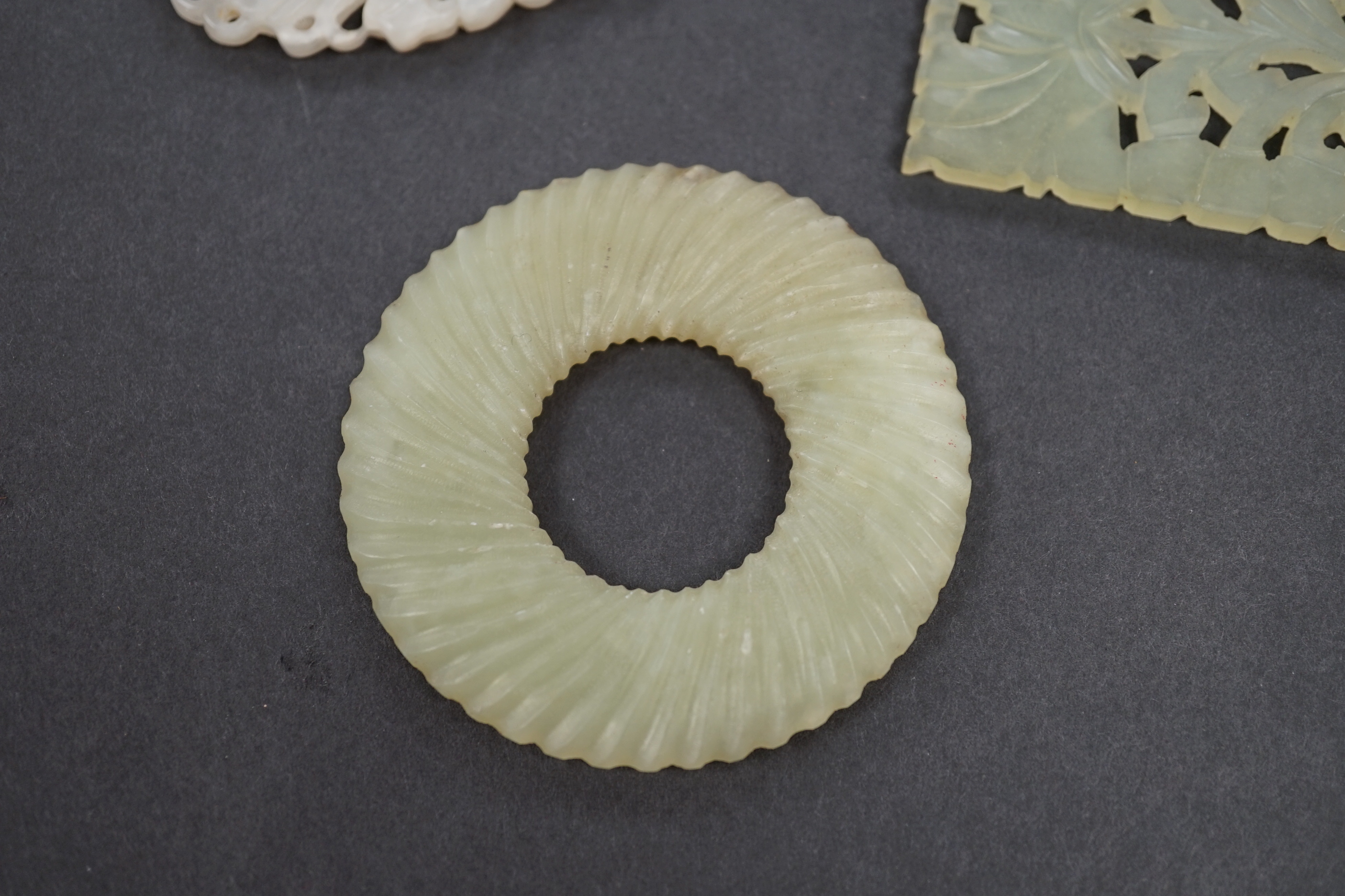 Four Chinese bowenite and jade carvings, the largest 7.8 cm